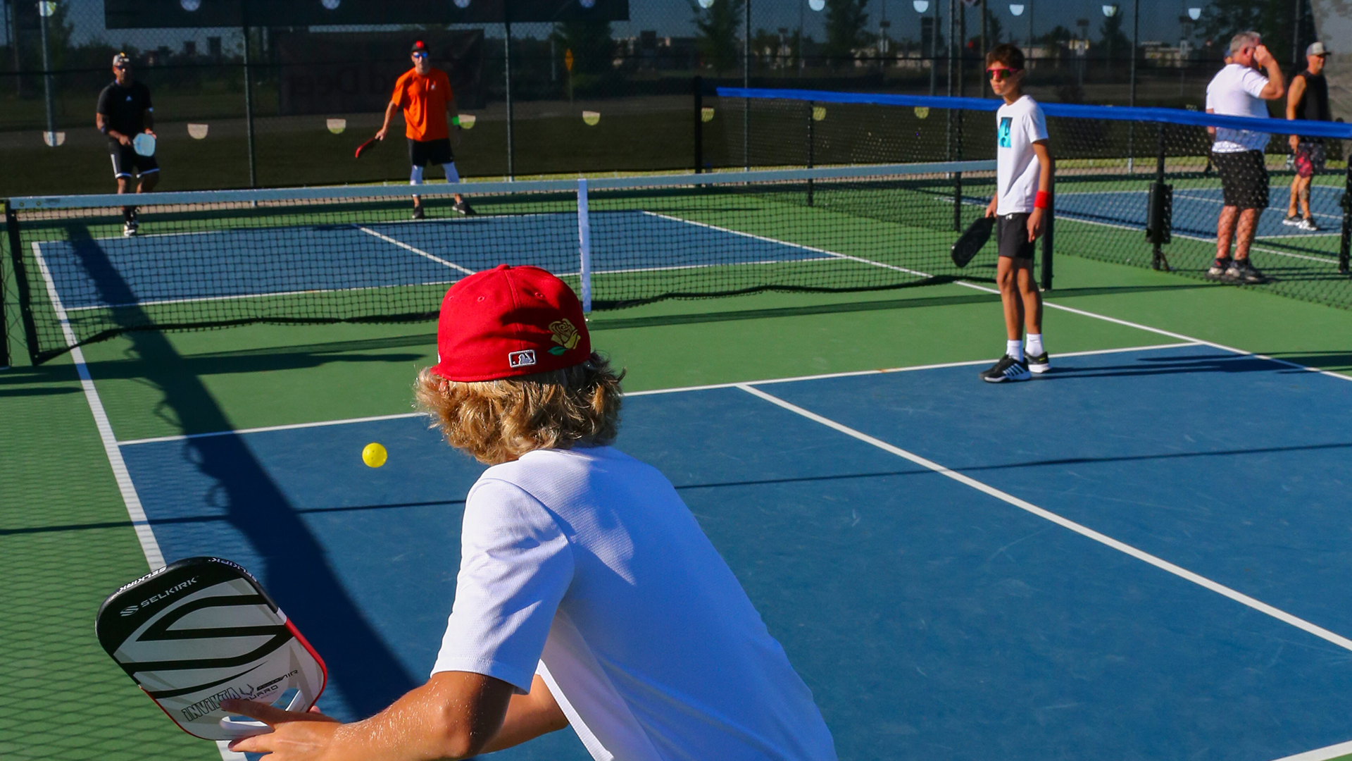 outdoor pickleball courts - two women getting ready to play