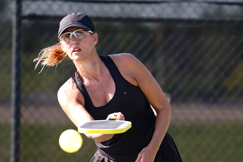 outdoor pickleball courts - man smashing